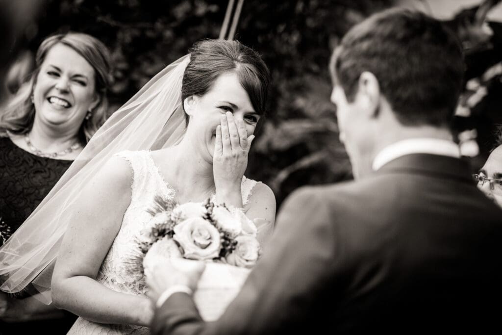 Bride reacts to groom reading vows during Beauregard-Keyes House wedding