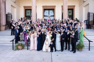 Large group shot at wedding on front steps of church