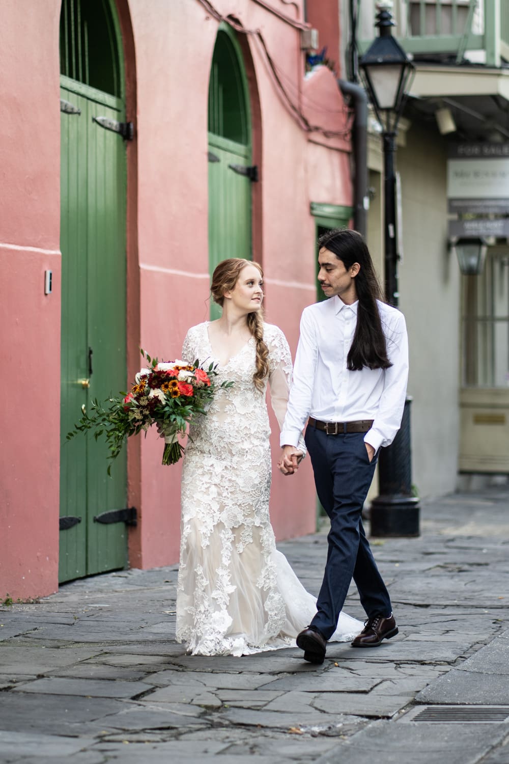 Elopement couple walking in French Quarter