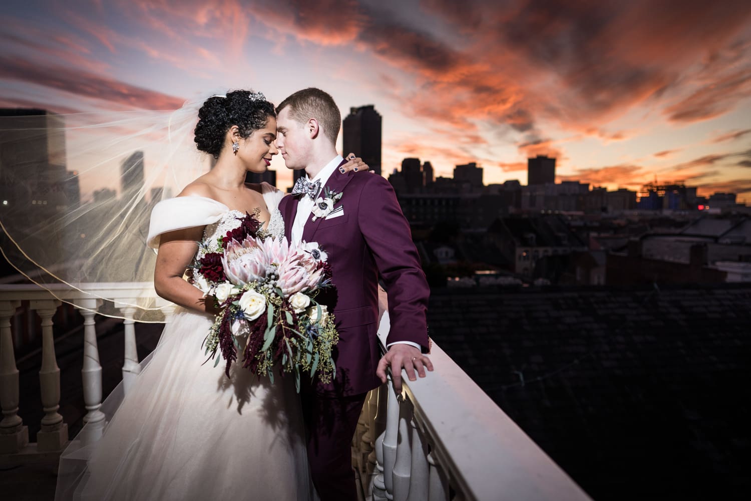 Portrait of bride and groom on cupola of Cabildo in New Orleans