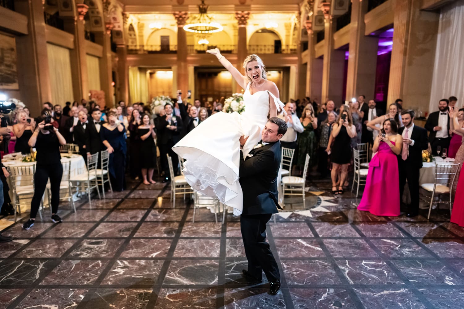 Groom lifts bride at Capital on Baronne wedding