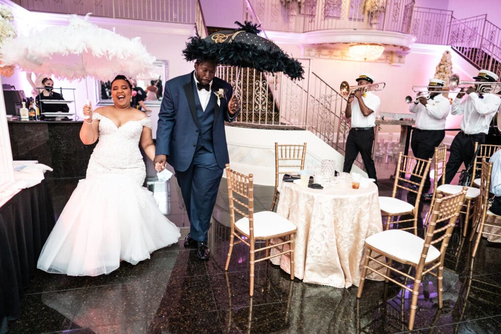 Bride and groom second line around the room at Champagne Palace