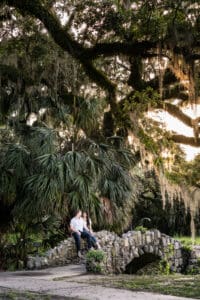 Couple sitting on bridge in New Orleans City Park