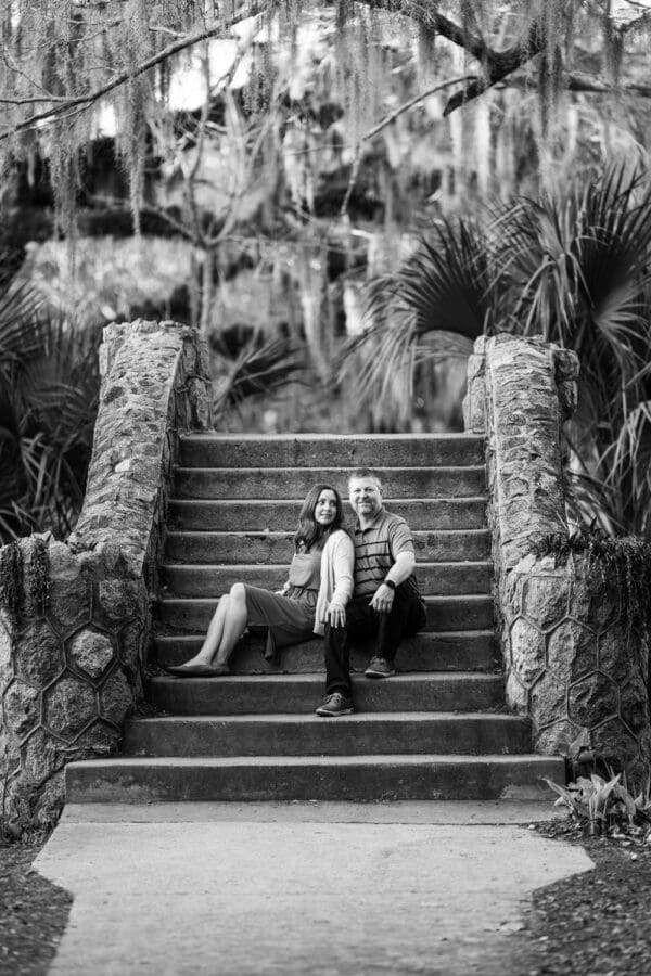 Couple sitting on bridge in City Park