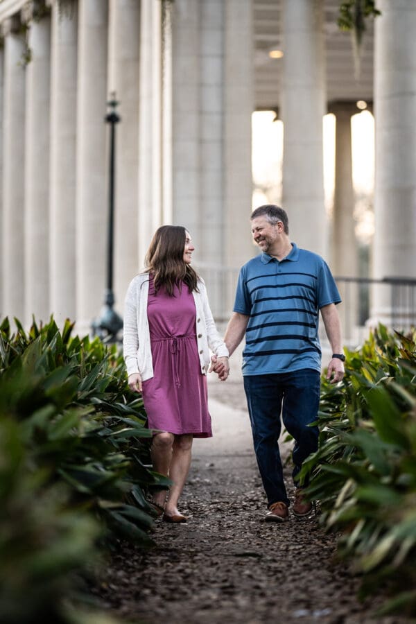 Couple walking along pathway with Peristyle in the background