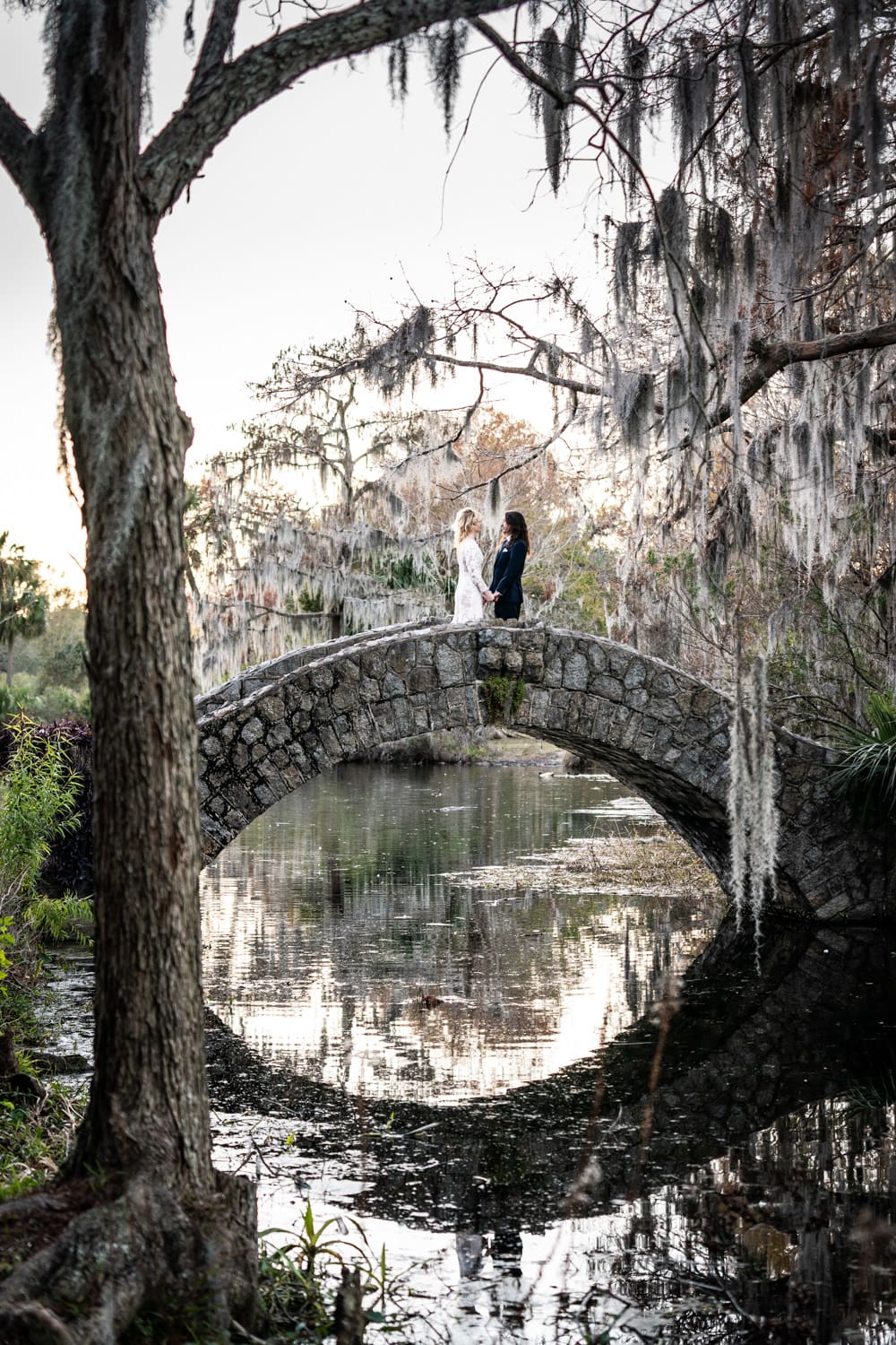 Bride and groom on Langles Bridge in City Park