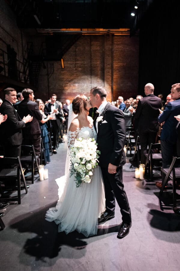 Bride and groom kissing at Civic Theatre wedding