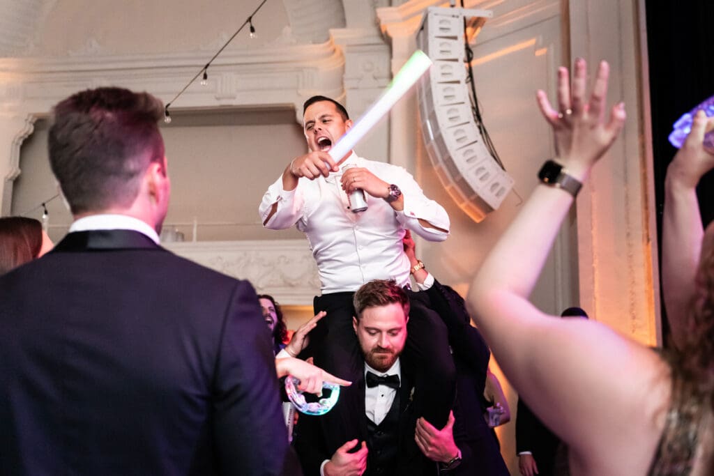 Groom on groomsman's shoulder's at Civic Theatre