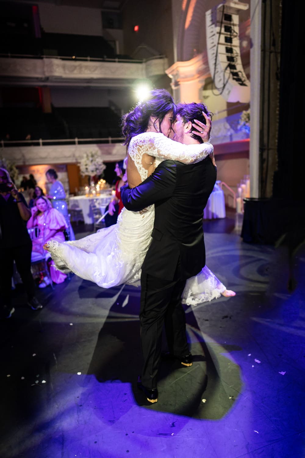 Groom lifts bride during dance at Civic Theatre wedding