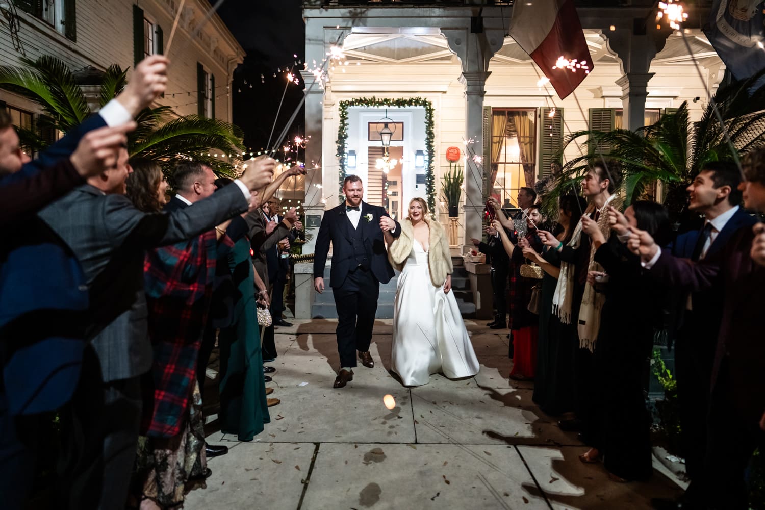 Couple walks through sparkler send-off at Degas House wedding