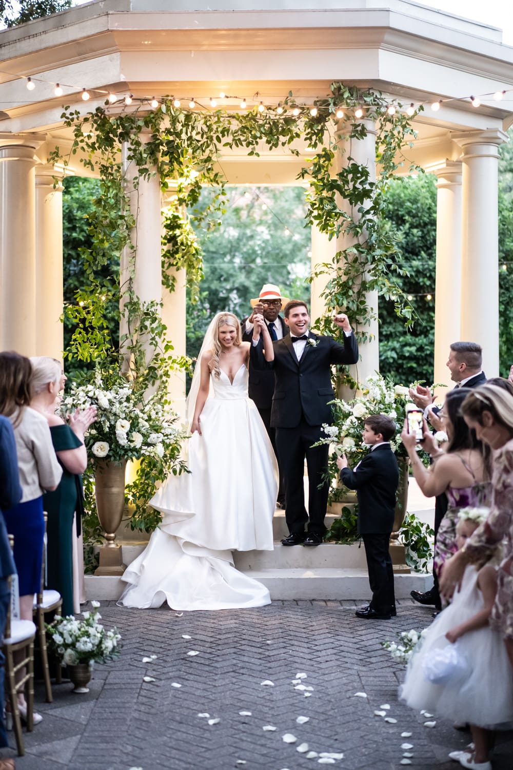 Bride and groom standing in front of gazebo at Elms Mansion wedding