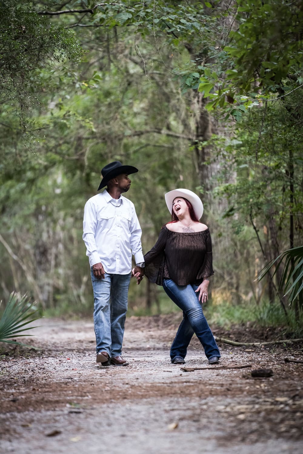 Couple walking through the woods at Fontainebleau State Park in Mandeville