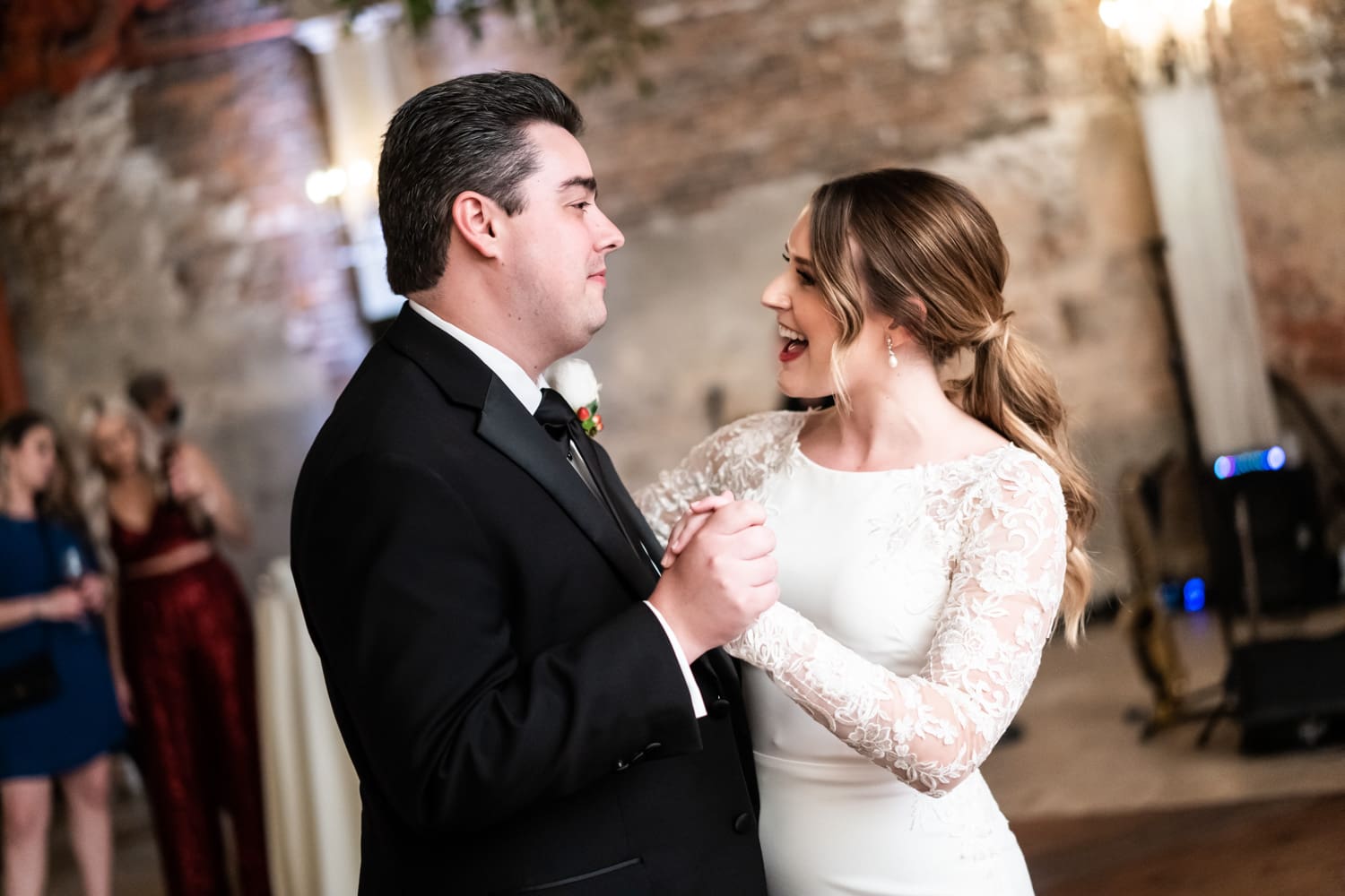 Bride and groom dance at Gallery Venue at Tomas Bistro wedding