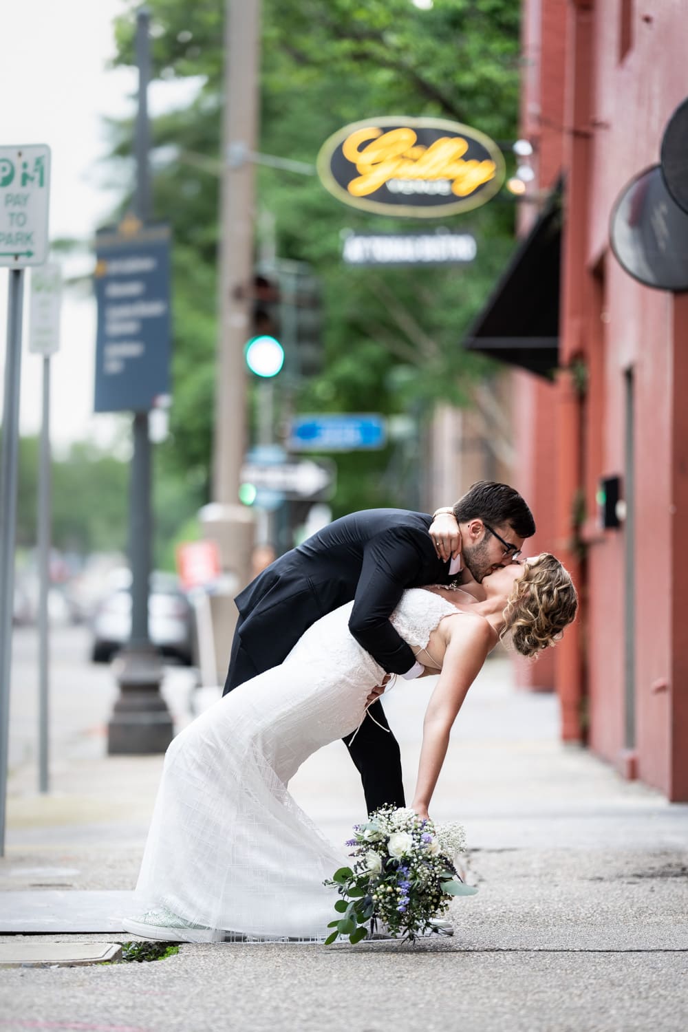 Bride and groom dip in front of Gallery Venue at Tomas Bistro in New Orleans