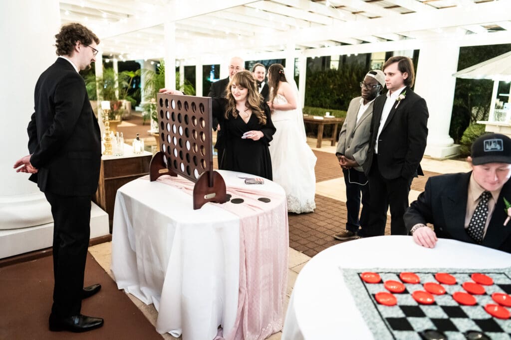 Wedding guests playing connect four