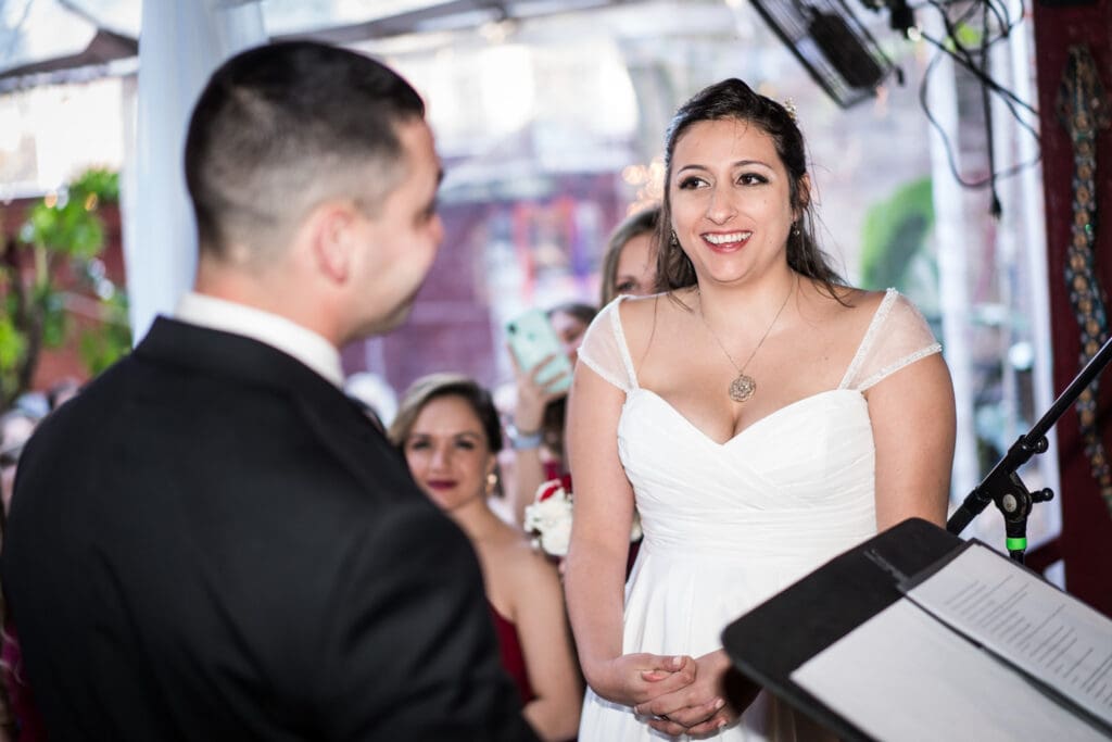 Bride smiling during ceremony