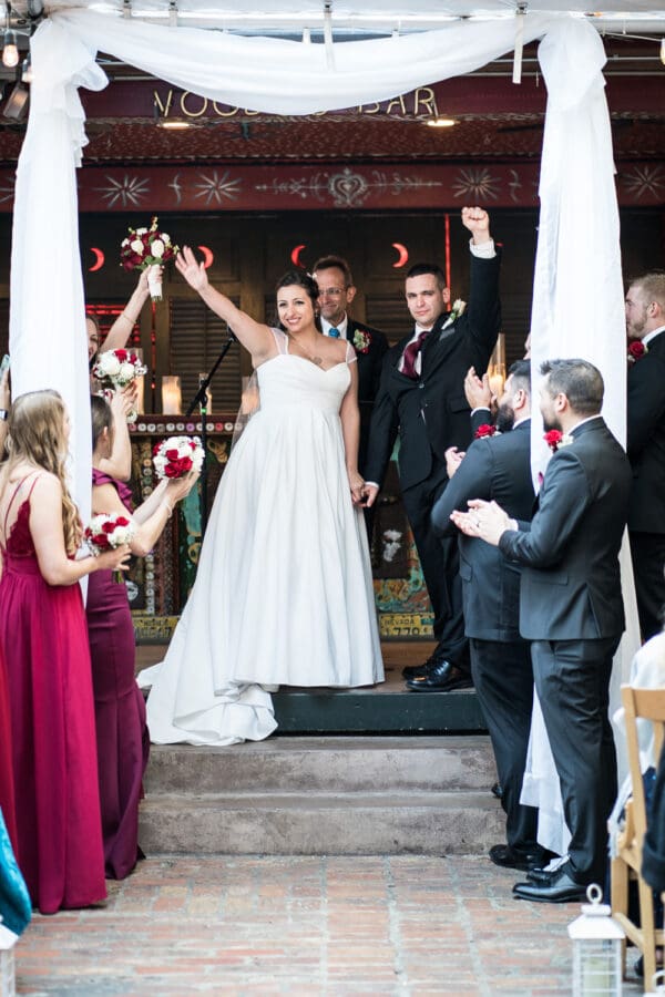 Bride and groom celebrate at end of House of Blues ceremony