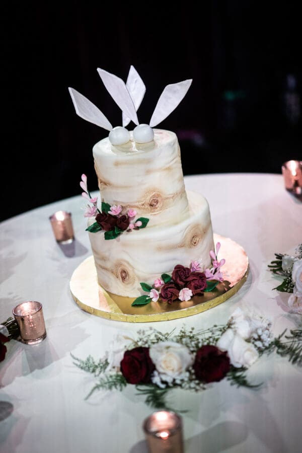 Wedding cake with Harry Potter golden snitch topper.