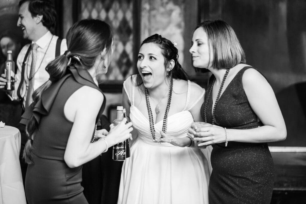 Bride laughs with friends at House of Blues