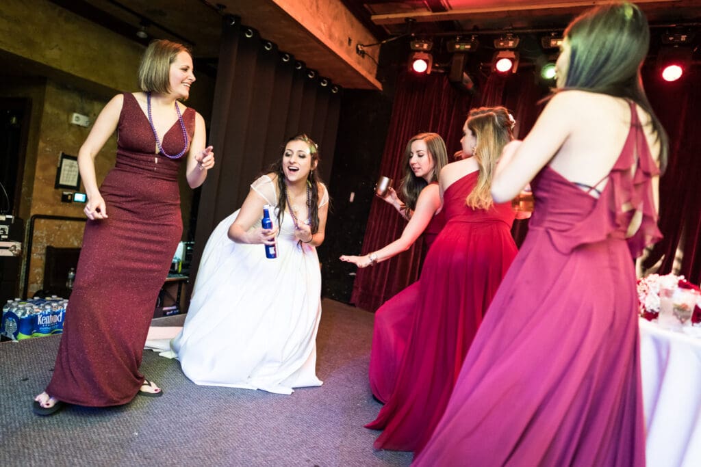 Bride and bridesmaids dancing at House of Blues