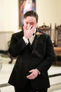 Groom cries as bride makes entrance into wedding ceremony at Immaculate Conception in New Orleans