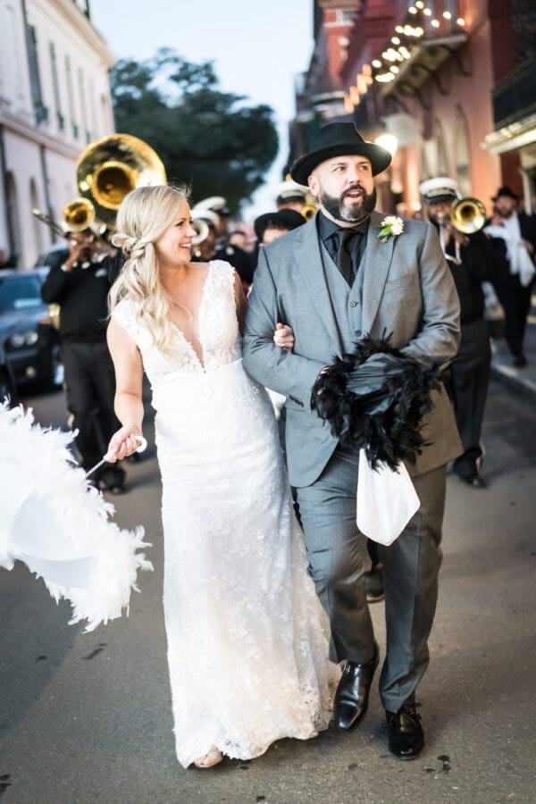 Bride and groom second line parade through the French Quarter