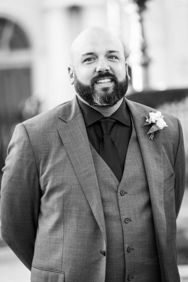 Groom sees bride coming down the aisle in Jackson Square