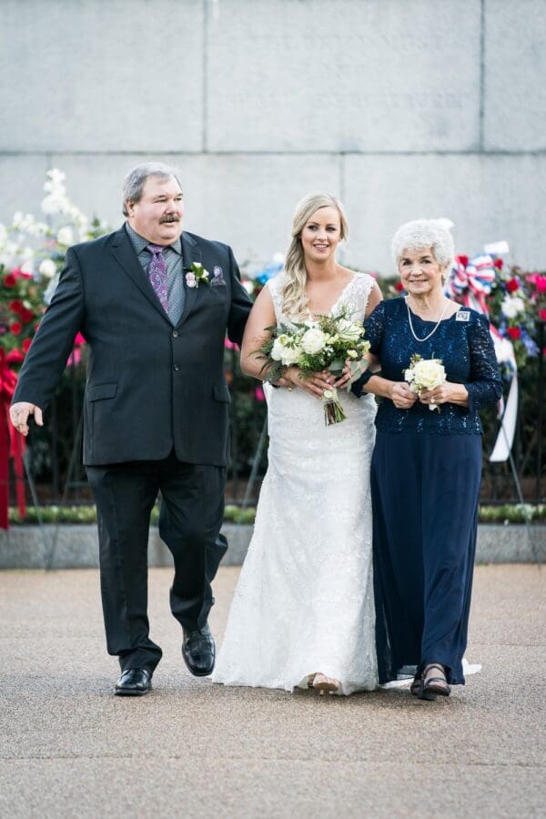 Bride and parents walk down aisle in Jackson Square wedding