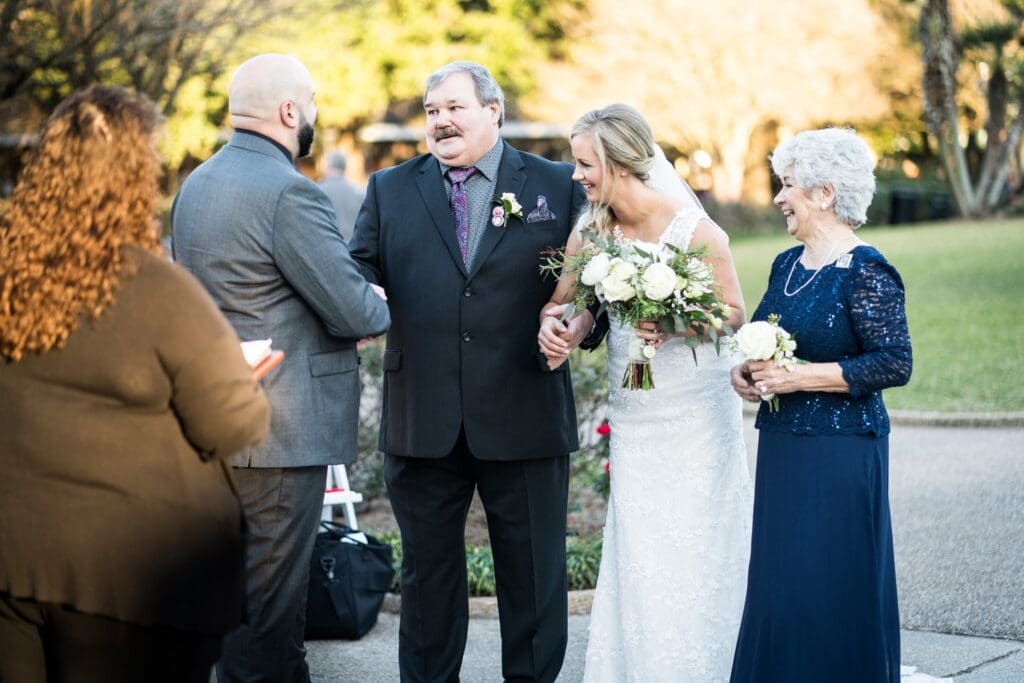 Bride's father gives her away to groom in Jackson Square