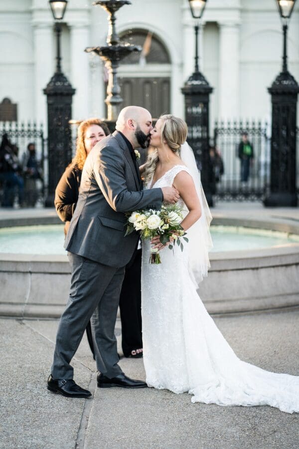 Bride and groom kiss at Jackson Square wedding ceremony