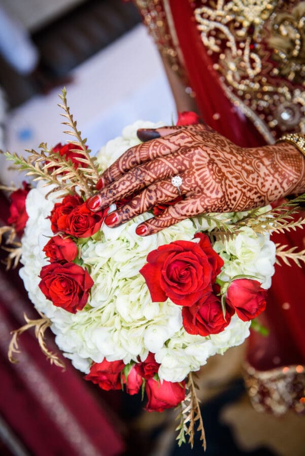 Bouquet and bride's hand