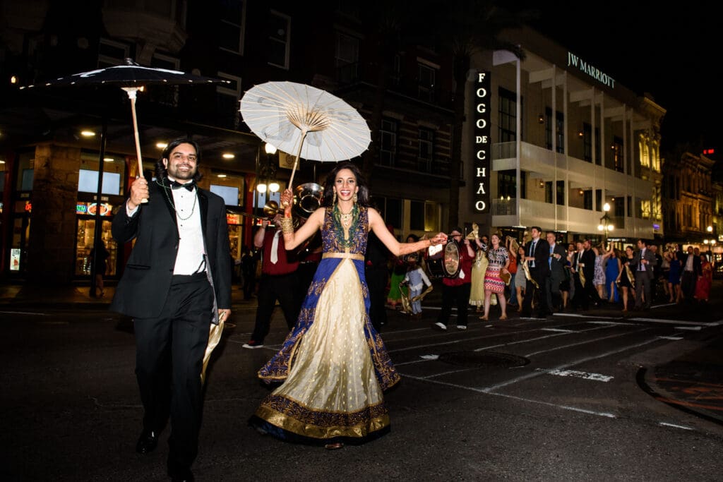 Bride and groom second line down Canal Street