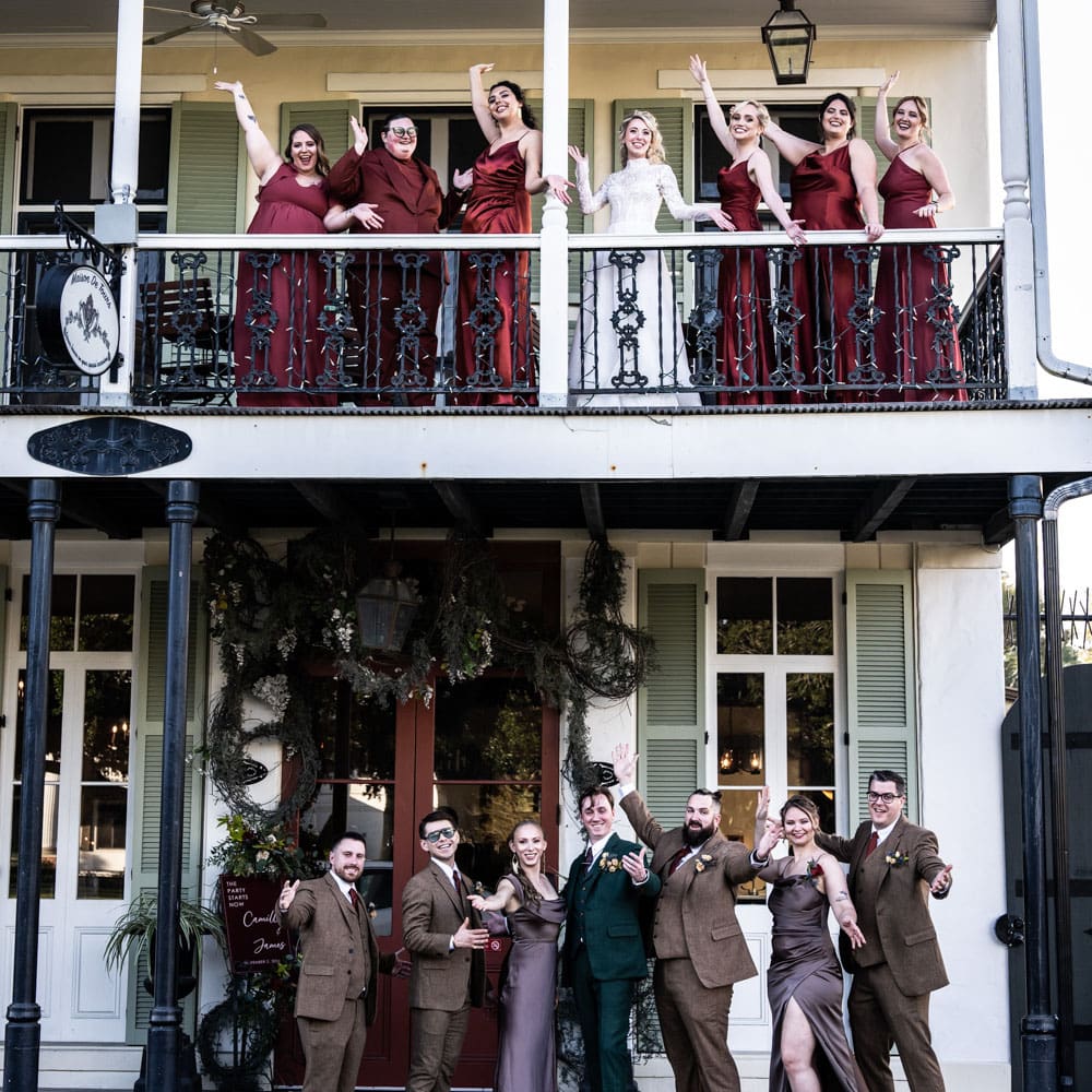 Bridal party on balcony at Maison de Tours in St. Martinville