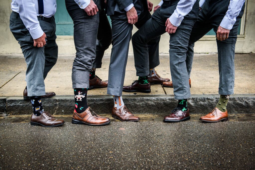 Groomsmen show off socks