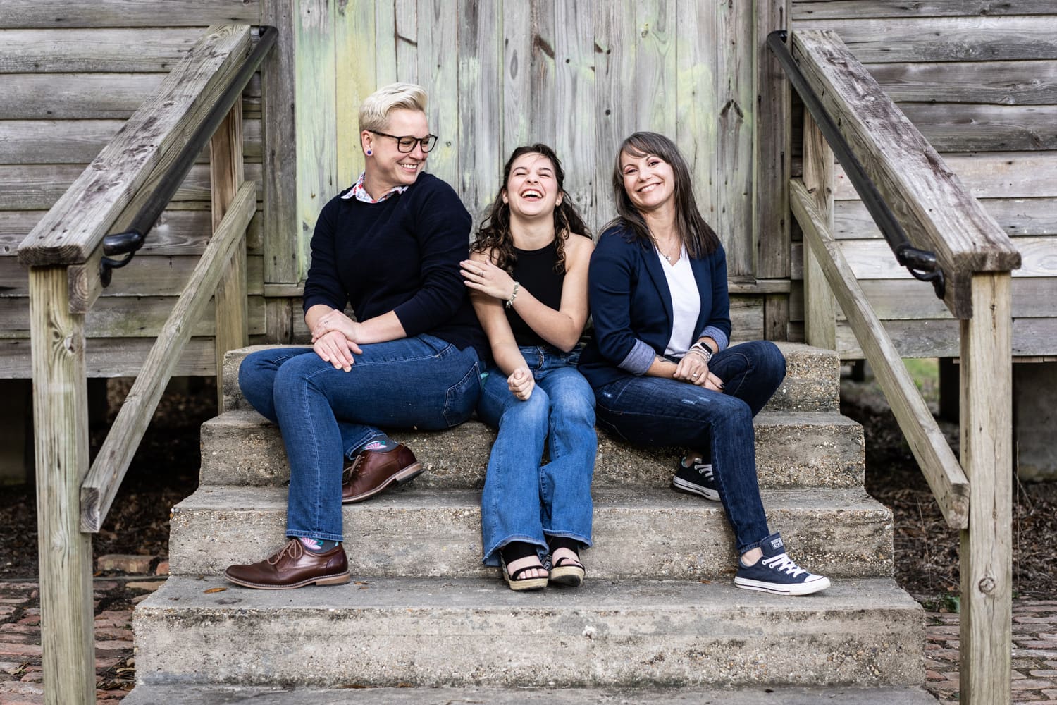 Family portrait in Mandeville, sitting on steps of Dew Drop Inn