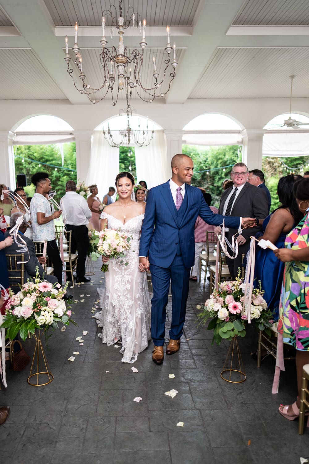 Bride and groom walk down aisle at Maison Lafitte wedding in Mandeville