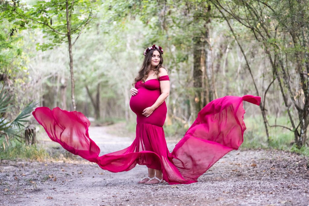 Pregnant mother's dress blowing the wind at Fontainebleau State Park in Mandeville