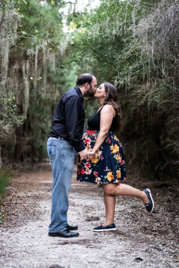 Maternity portrait mother and father kissing