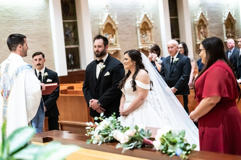 Bride and groom standing at altar