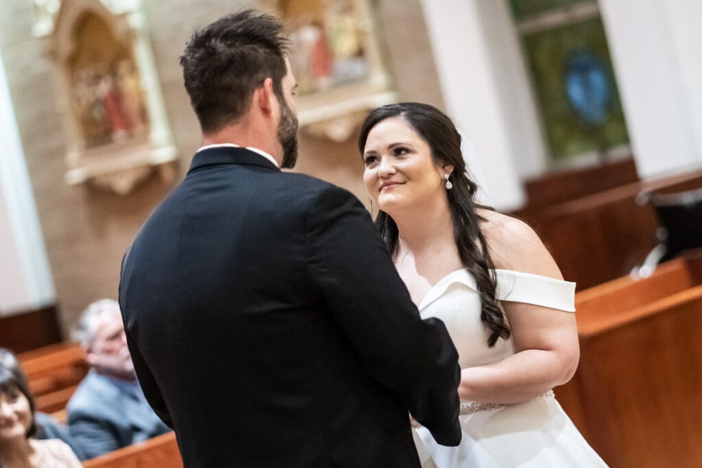 Bride smiles at groom