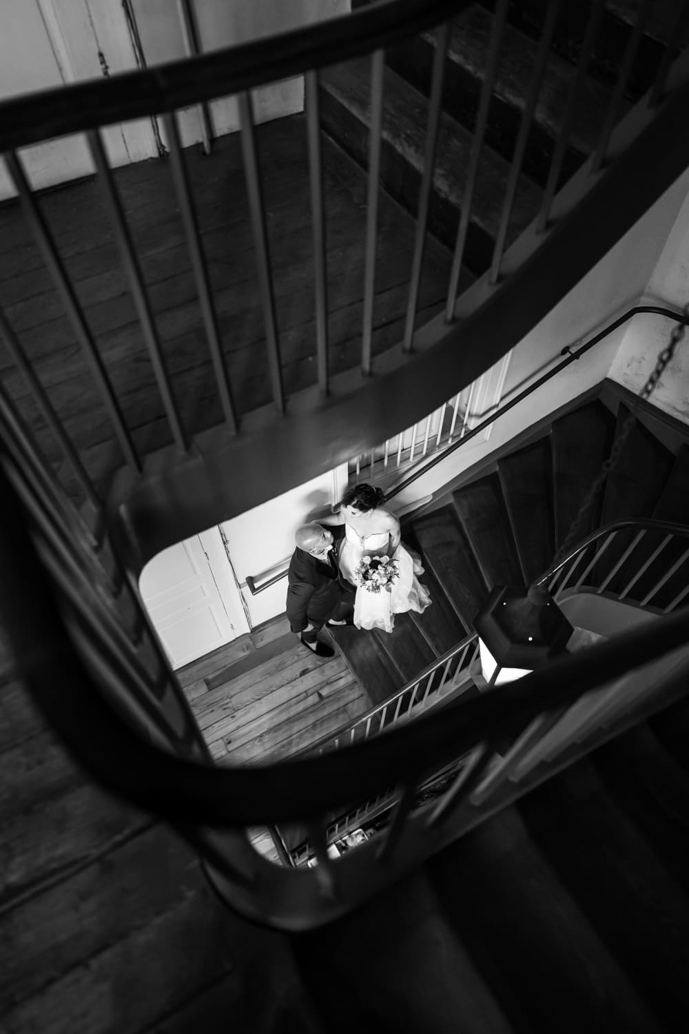 Bride and groom on stairs at Napoleon House wedding