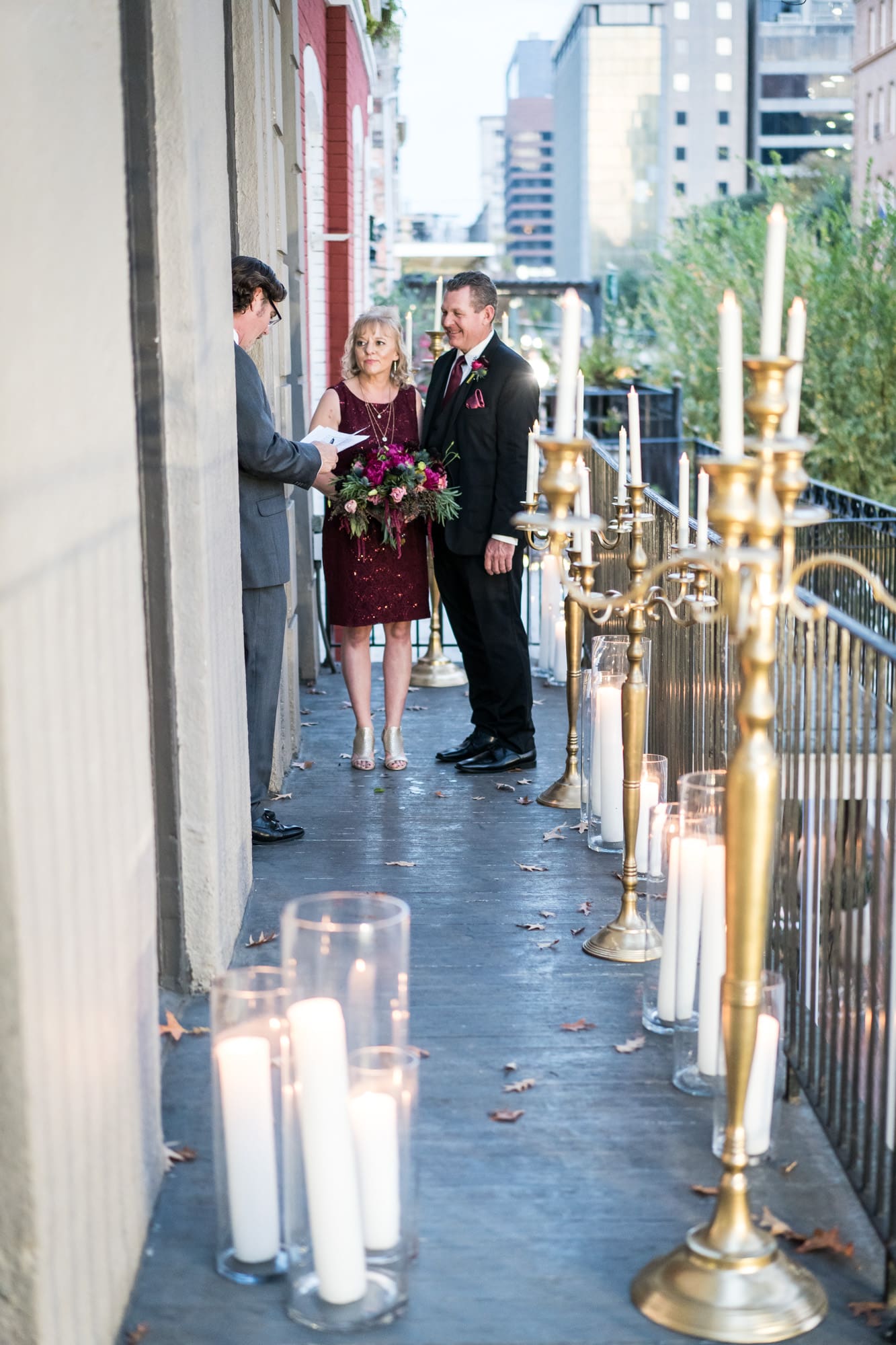 Couple eloping on balcony in New Orleans