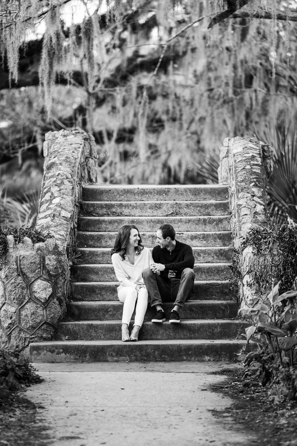 Couple sitting on Langles Bridge in City Park