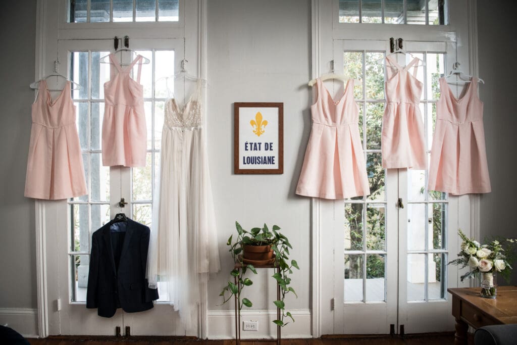 Bride and bridesmaids dresses hanging up in New Orleans home