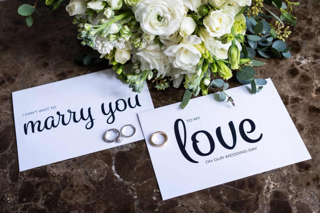 Couple's vows with rings and bouquet