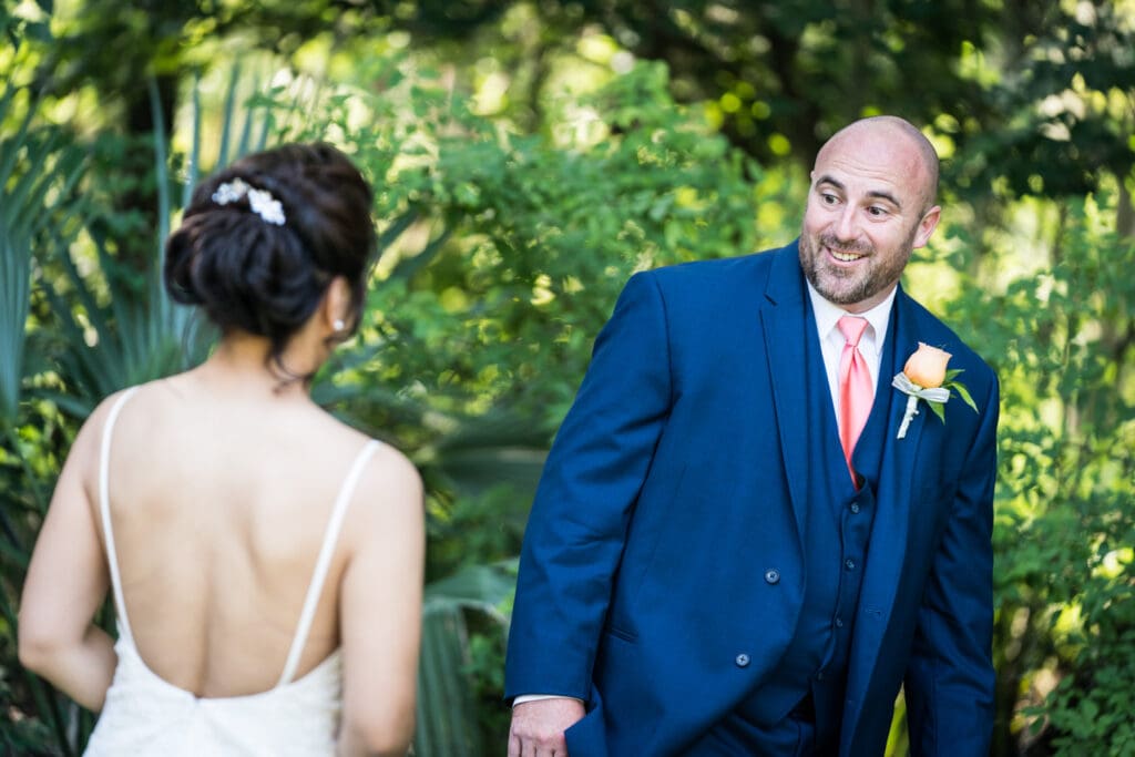 Groom sees bride during first look