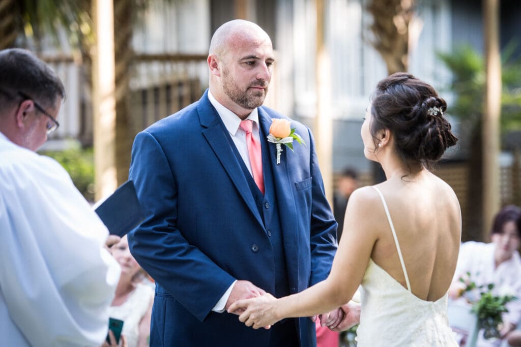 Bride and groom holding hands