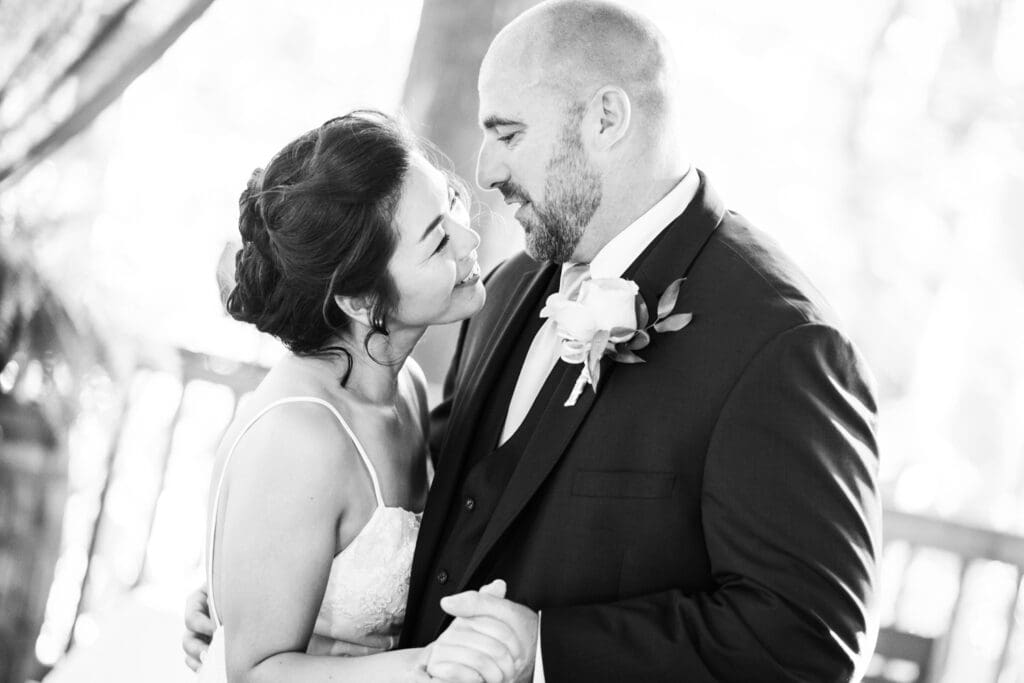 Bride and groom smile during first dance