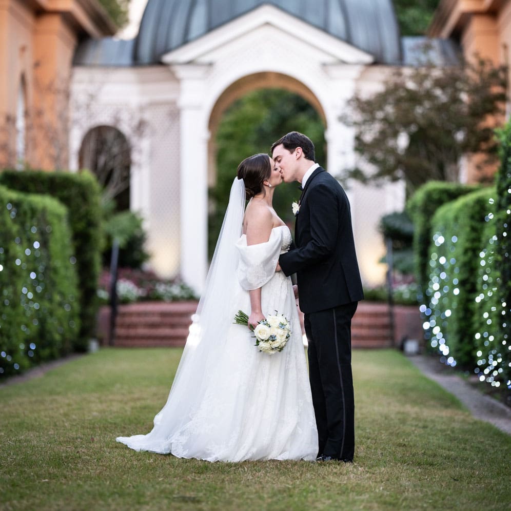 Bride and groom kissing at Pavilion of the Two Sisters wedding