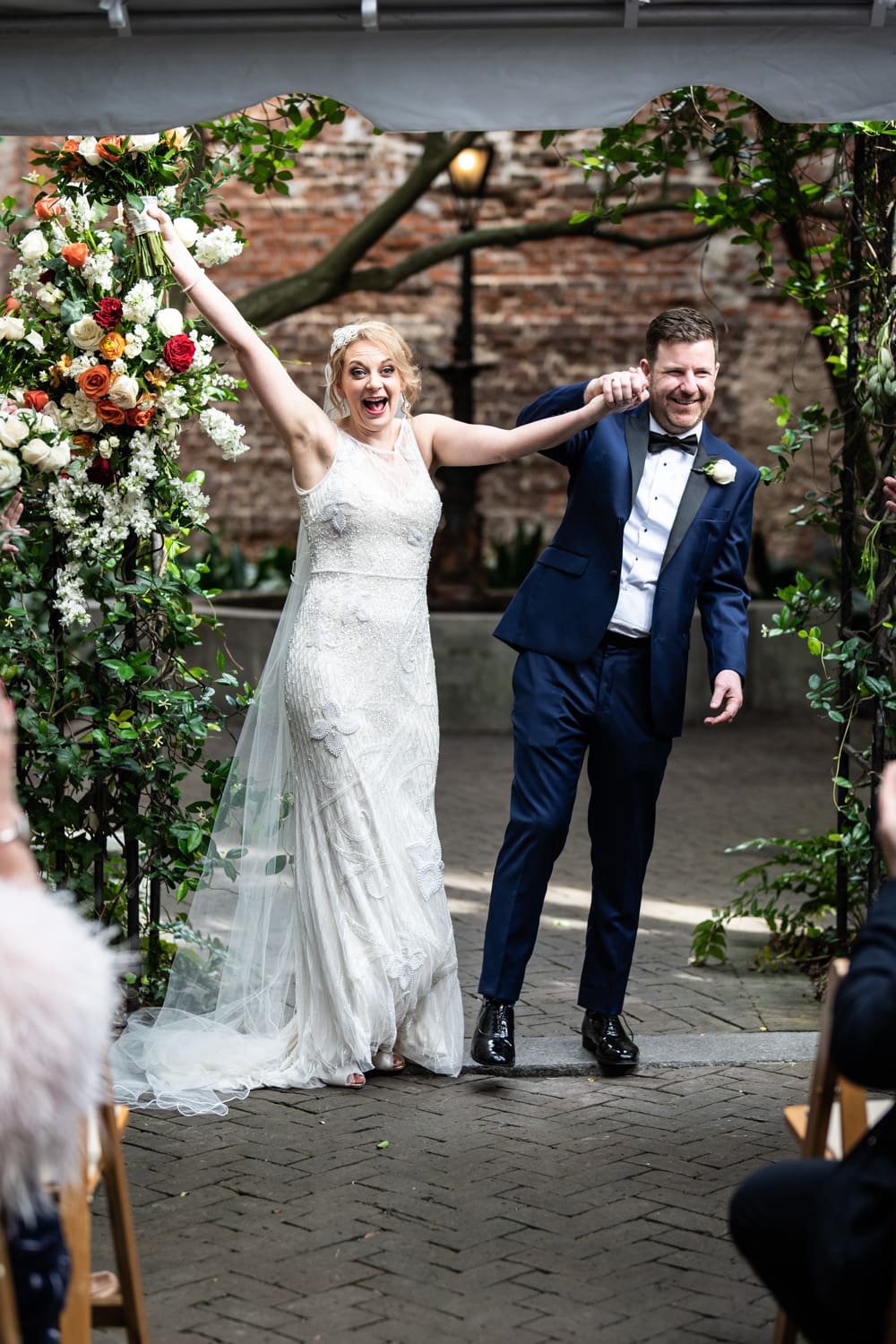 Bride and groom celebrate at Pharmacy Museum wedding in New Orleans